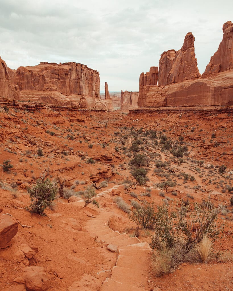 gloomy morning over courthouse towers and park avenue at sunrise in arches national park