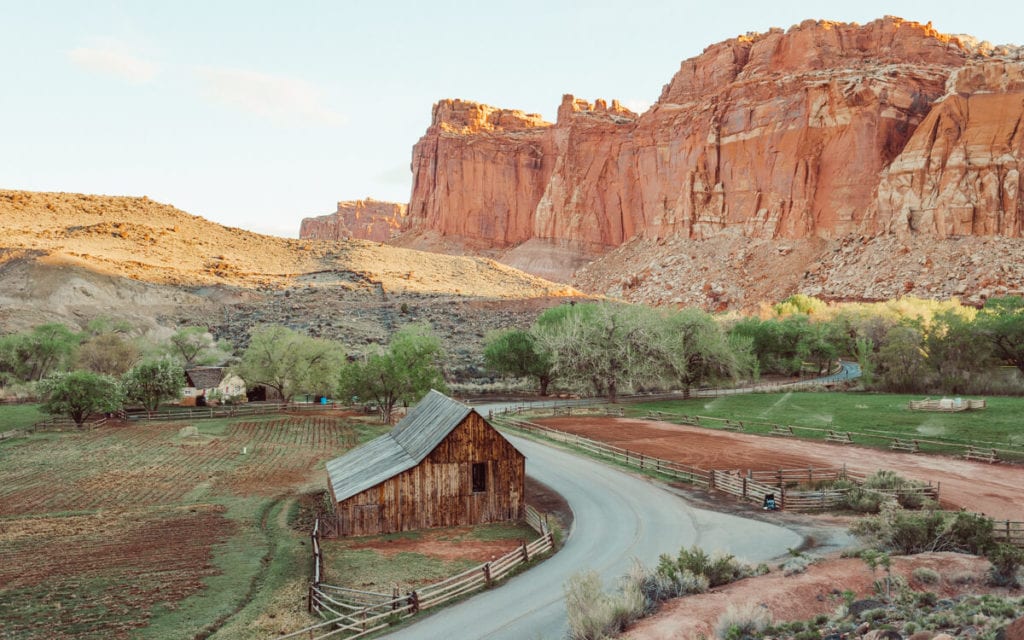 sunny day over gifford homestead in capitol reef national park during sunrise