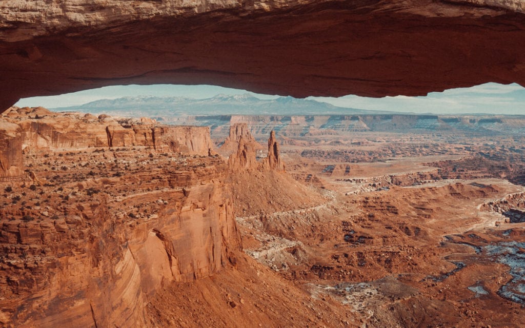 views of canyonlands from Mesa arch at sunrise