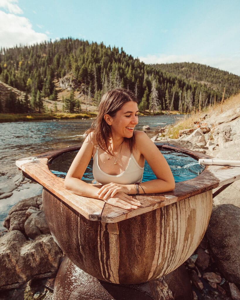 girl soaking in boat box hot spring in stanley idaho