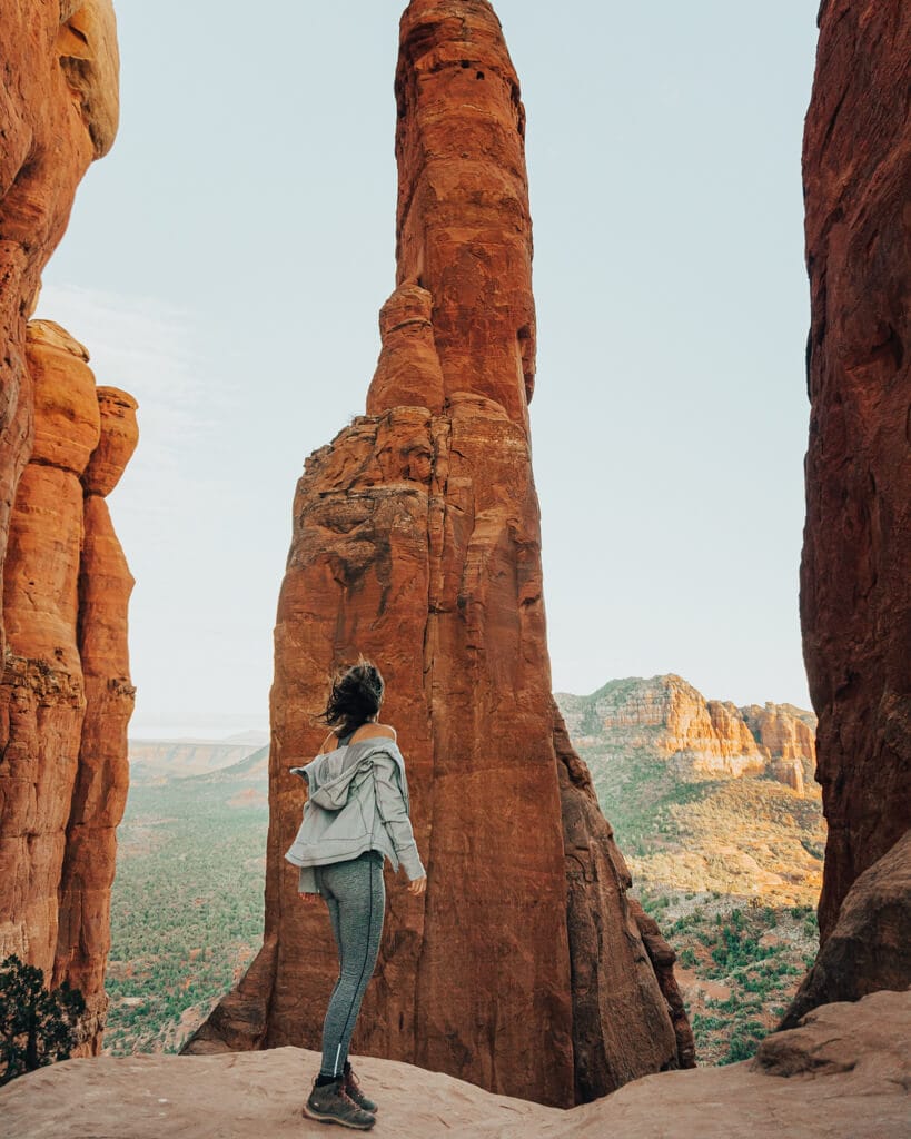 female hiker looking at cathedral rock vortex in sedona az