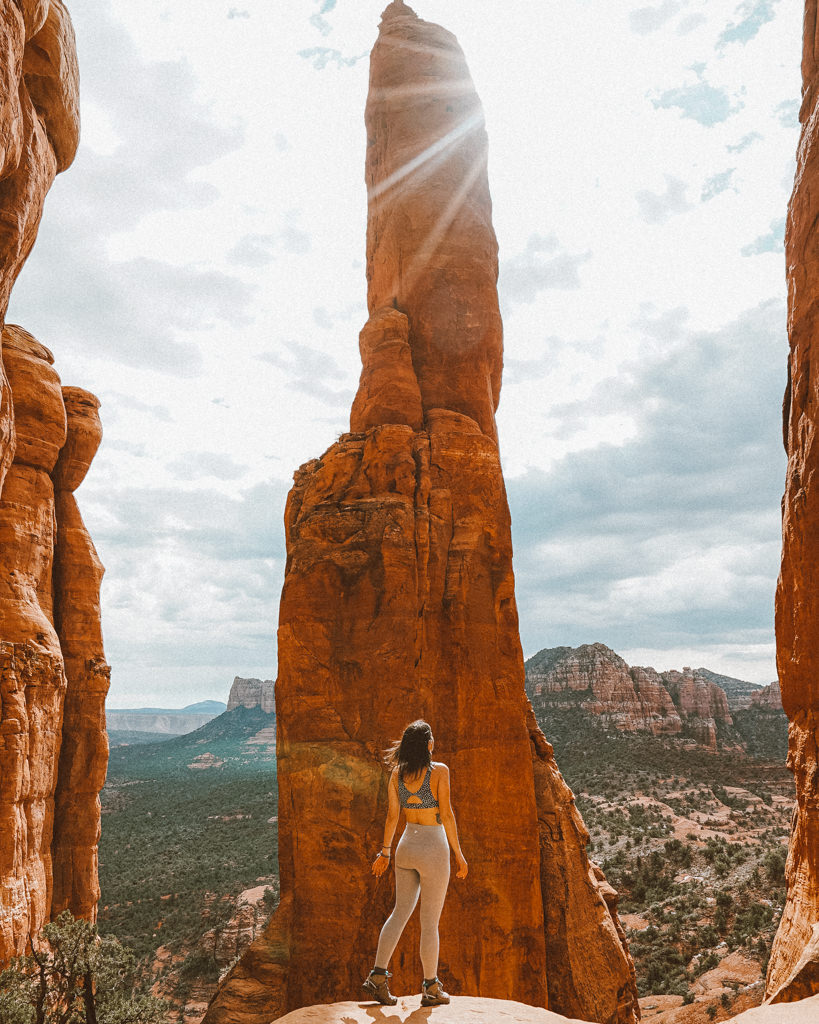 Best Sedona Hikes - Girl standing by Cathedral Rock vortex in Sedona, AZ