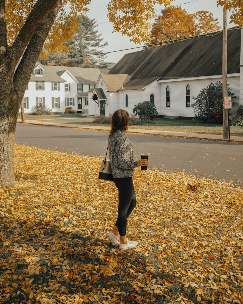 Girl standing in North Conway with fall foliage