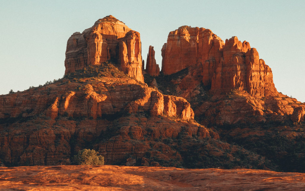 view of a red sunset on cathedral rock vortex from red rock crossing sedona arizona