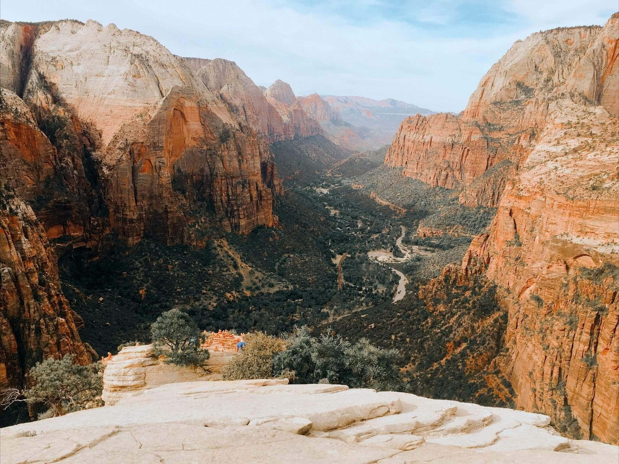 view of a sunny morning sunrise over angels landing in zion national park utah
