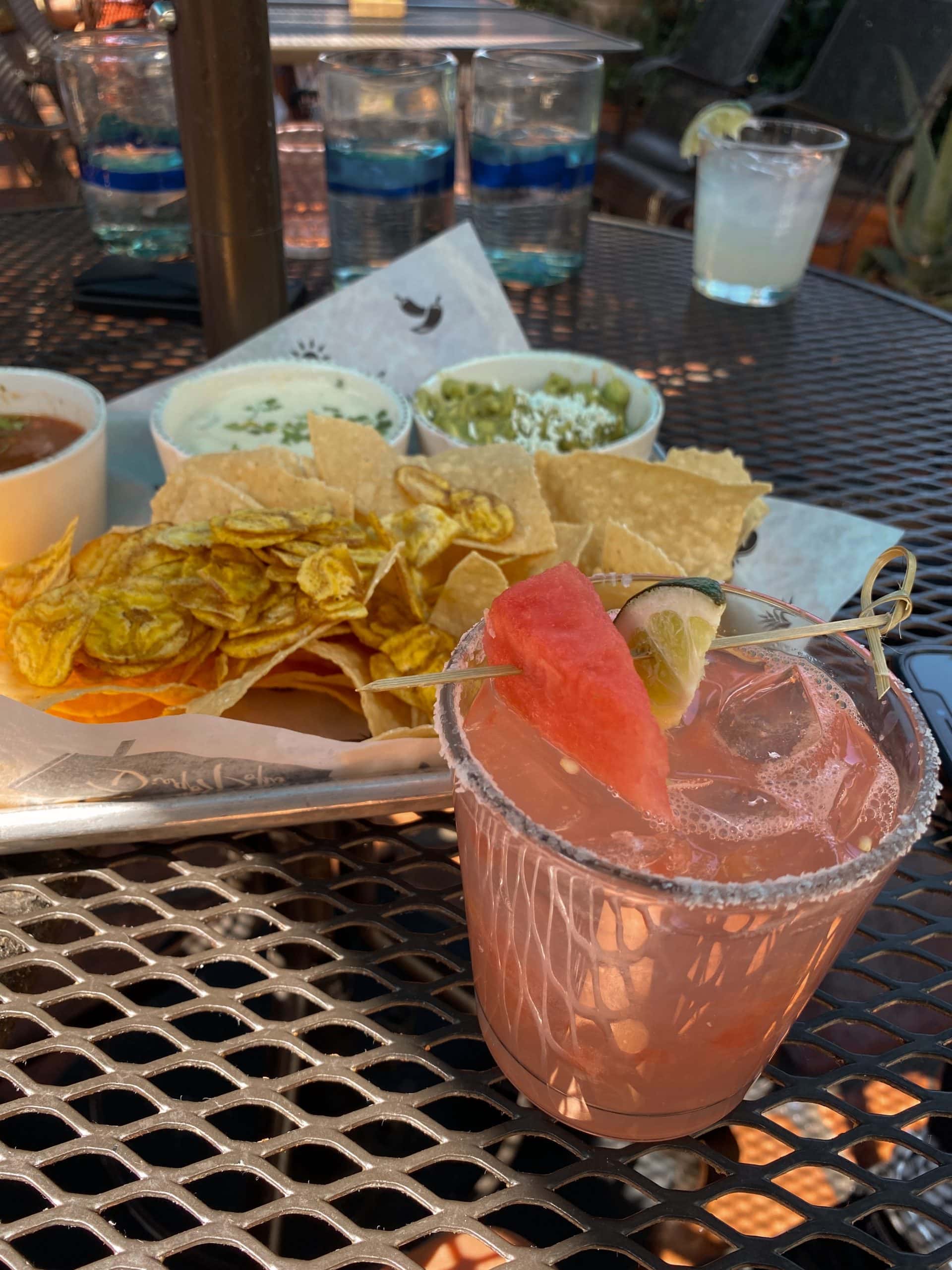 picture of a watermelon margarita and chips and guacamole at diego pops in scottsdale