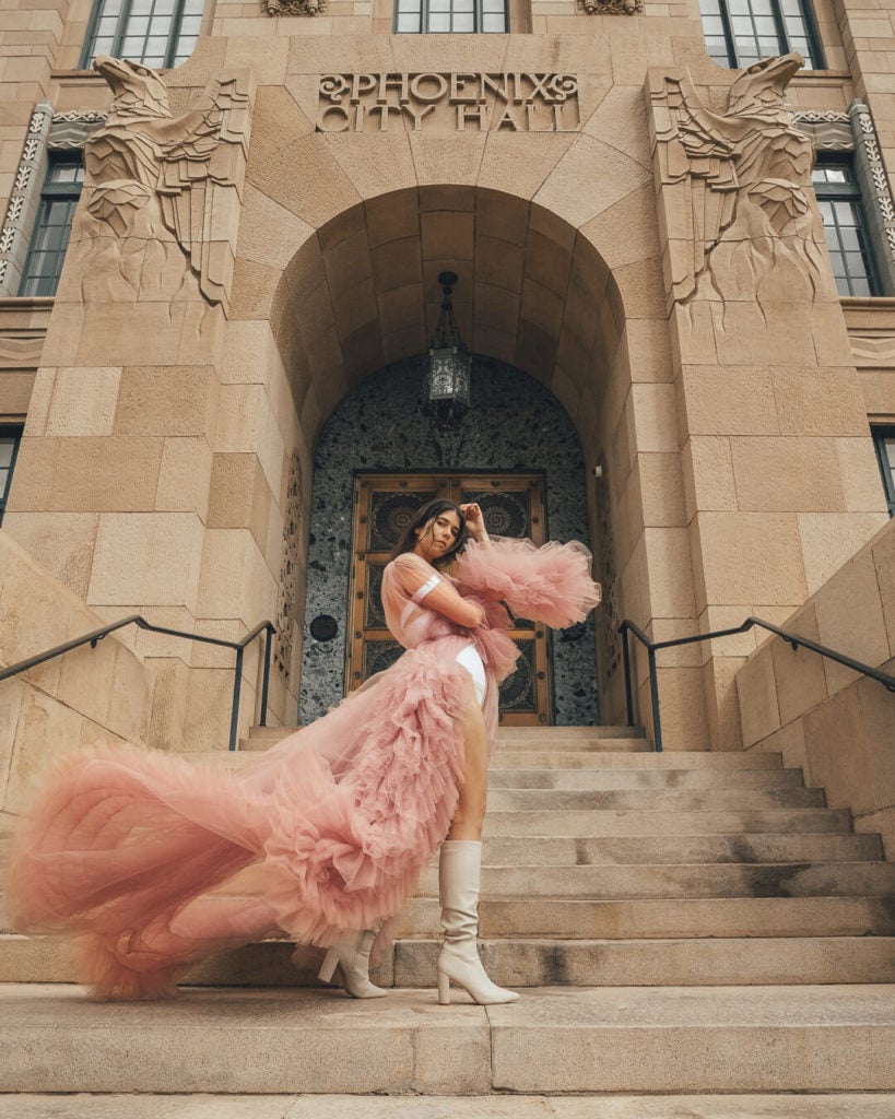 girl in a pink dress standing in front of phoenix city hall