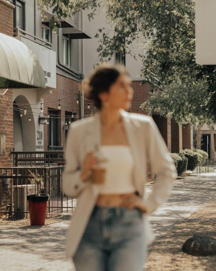 girl drinking coffee while walking down roosevelt rown in phoenix az