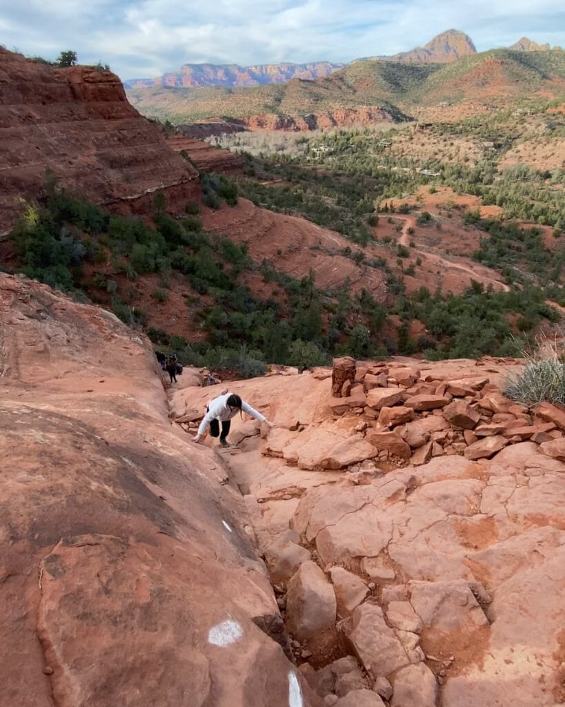 female hiker walking cathedral rock trail in sedona