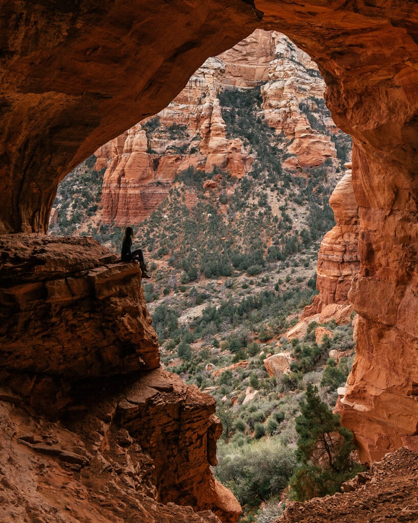 girl looking at the view from keyhole cave sedona az