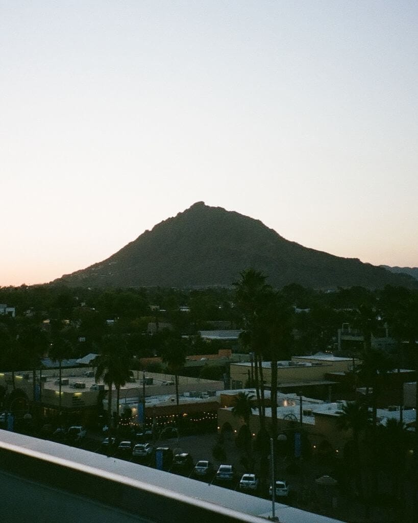 sunset over camelback mountain from outrider rooftop bar in scottsdale az