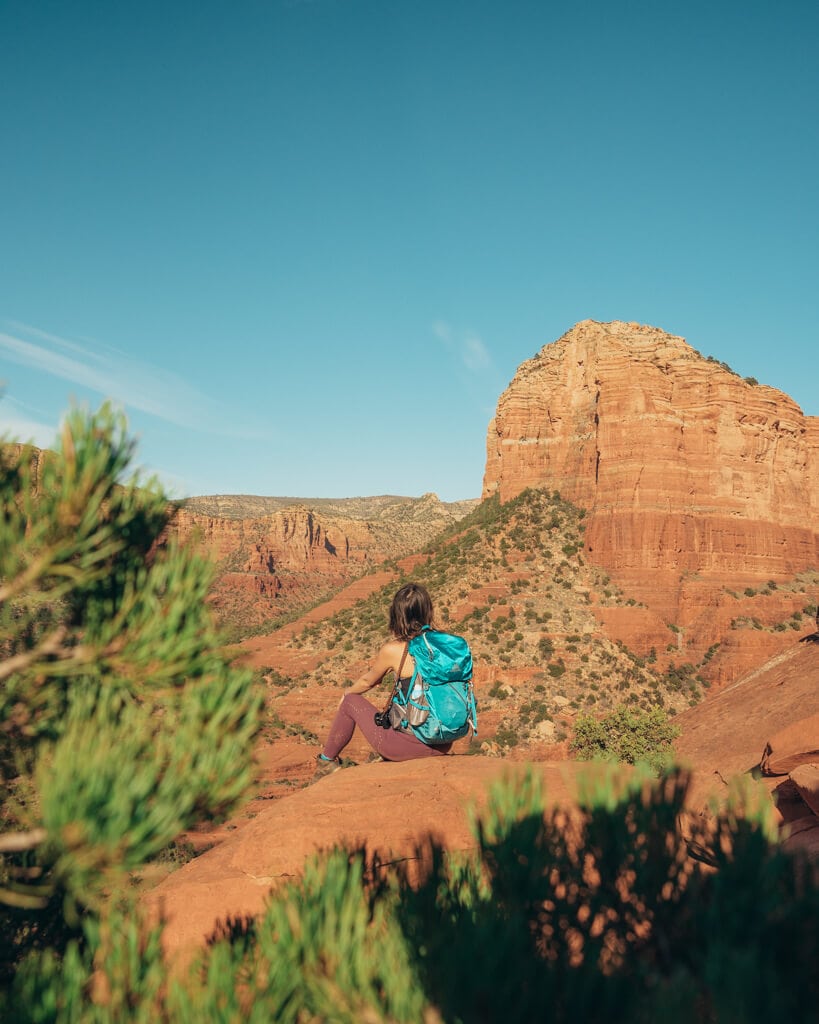 female hiker looking at courthouse butte in sedona arizona