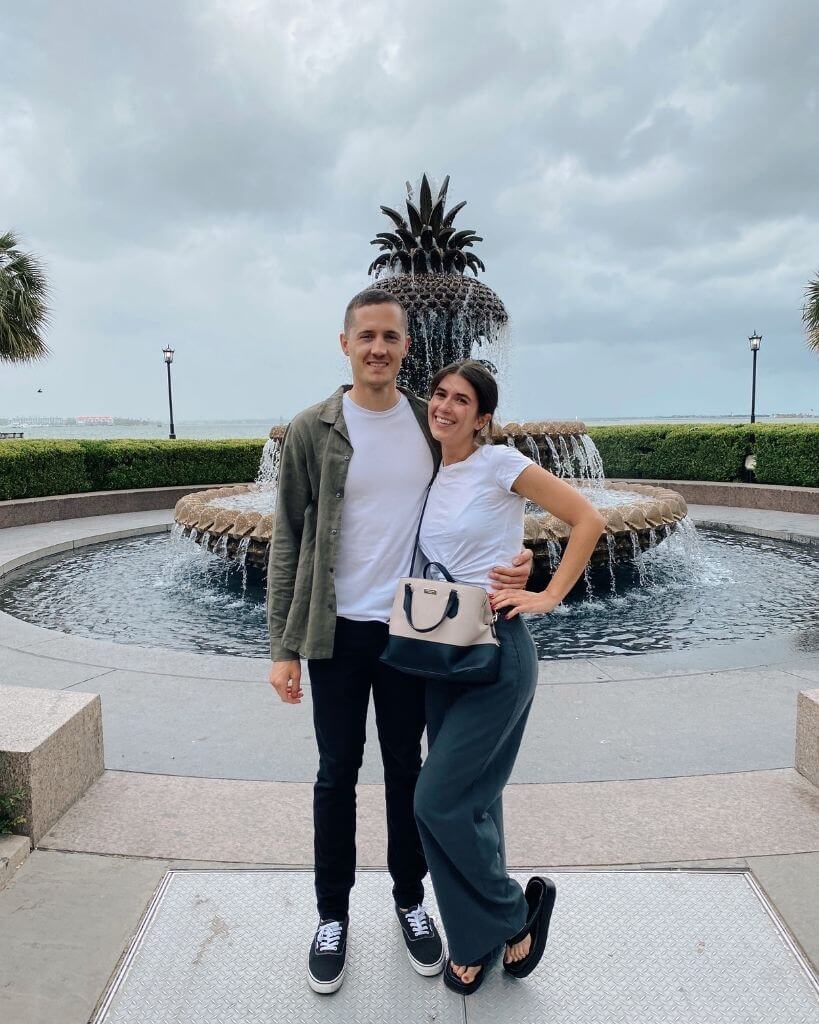 couple in front of pineapple fountain in charleston sc