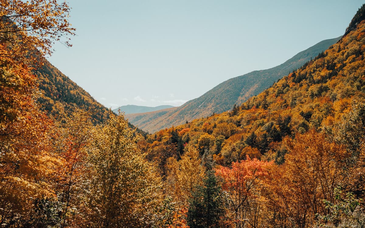 view of fall colors in crawford notch state park in white mountains nh