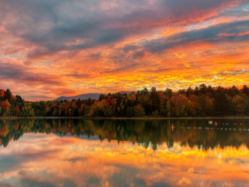 view of a pink fall sunset over Waterbury Reservoir in stowe vt