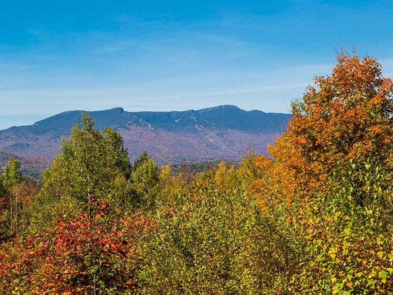 view of stowe vermont mount mansfield on a clear fall day