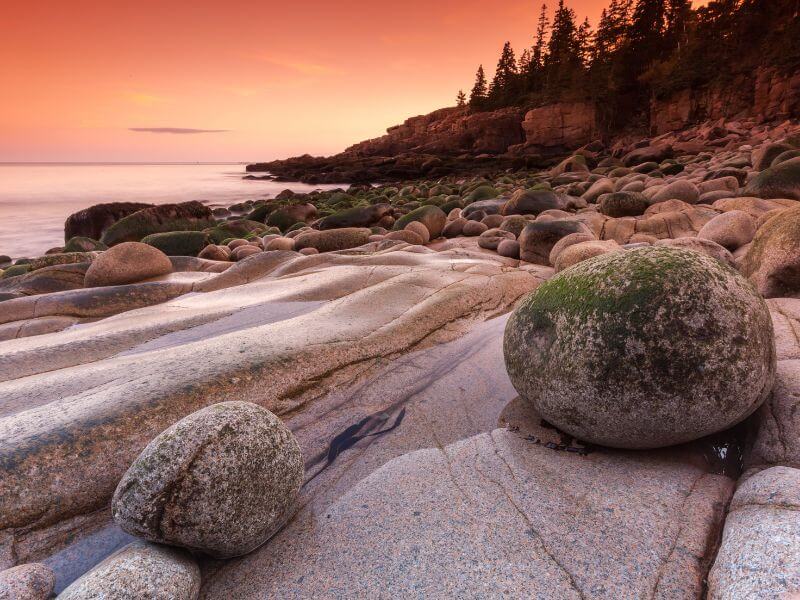 view of otter cliff at sunrise in acadia national park