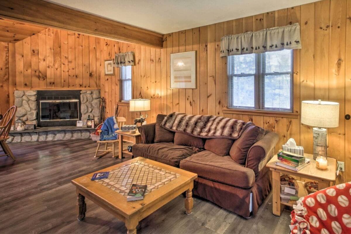 inside the living room of a wooden cabin in conway new hampshire