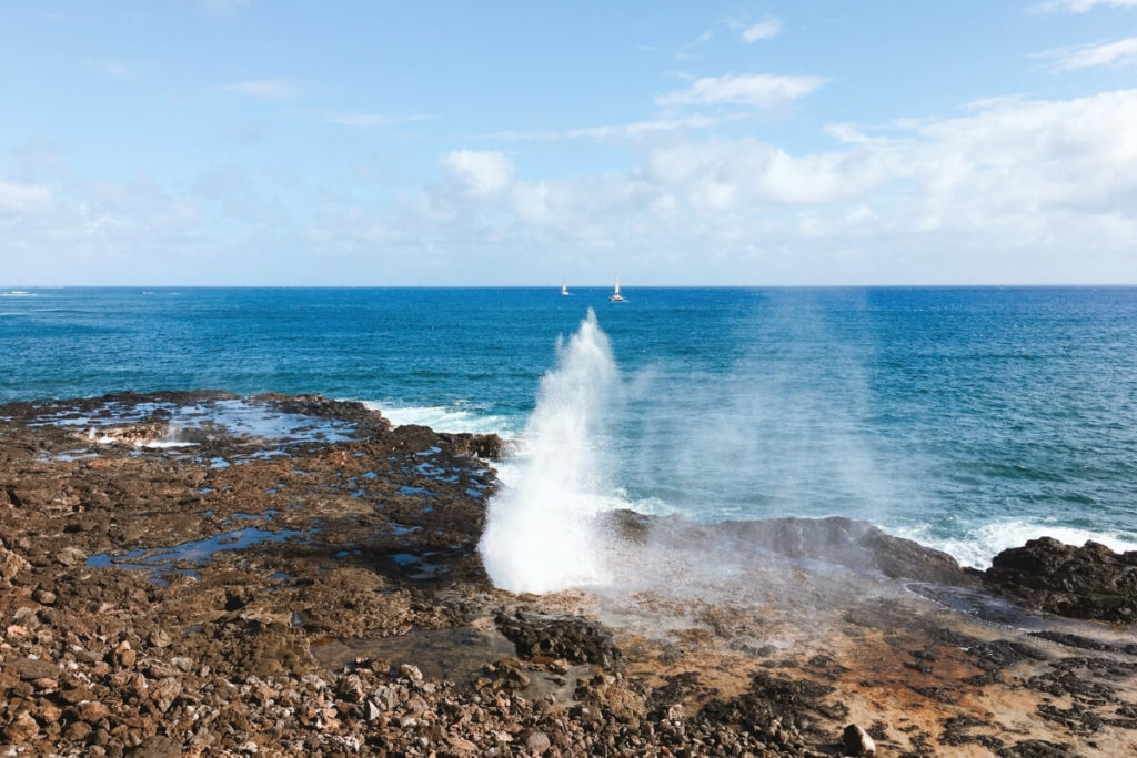clear blue sky over View of Spouting Horn in Kauai Hawaii