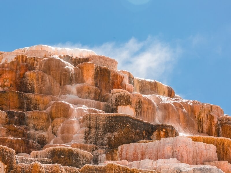 orange terraces on mammoth hot springs in yellowstone national park