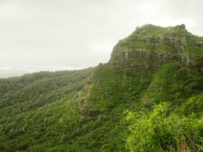 cloudy day over the lush green sleeping giant hike in kauai hawaii