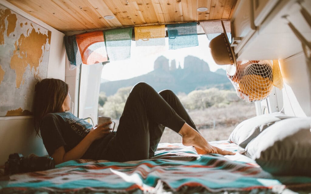 female in a campervan looking at cathedral rock in sedona arizona