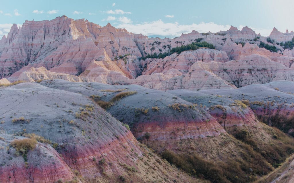 vibrant pink and purple colors along yellow munds in badlands national park south dakot