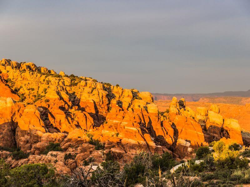 bright orange sunset on fiery furnace in arches np utah