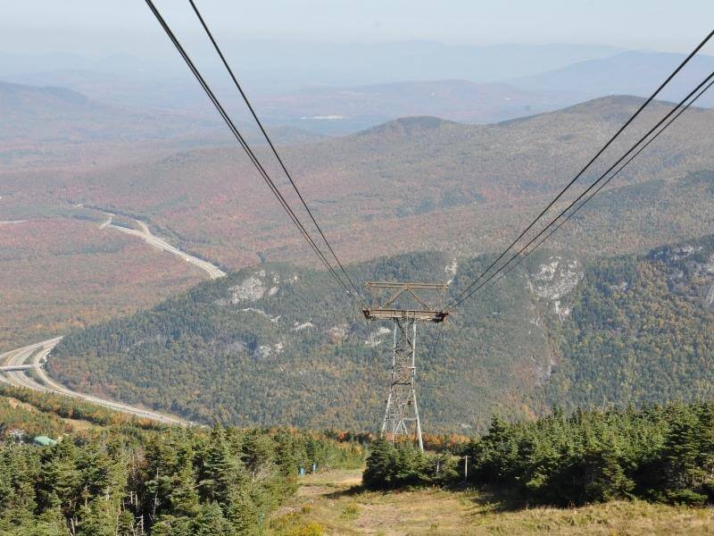 top of cannon mountain aerial in the fall with gold and red fall foliage
