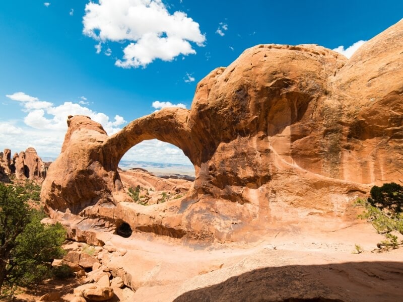 clouds over double o acrh in arches national park