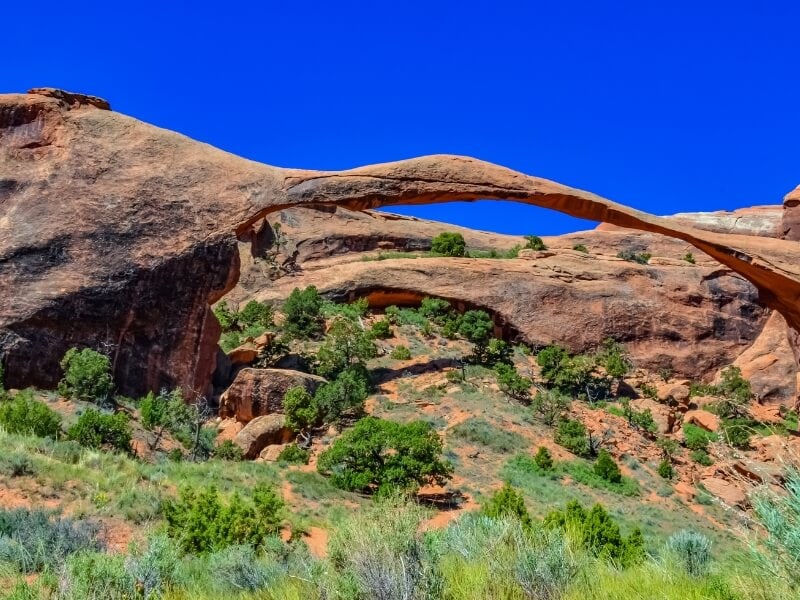 blue skies over landscape arch in arches national park utah