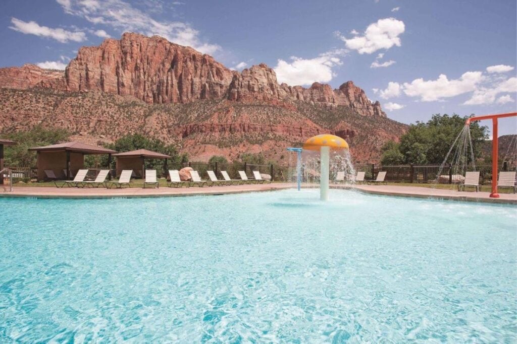 swimming pool with mountain view at la quinta zion park
