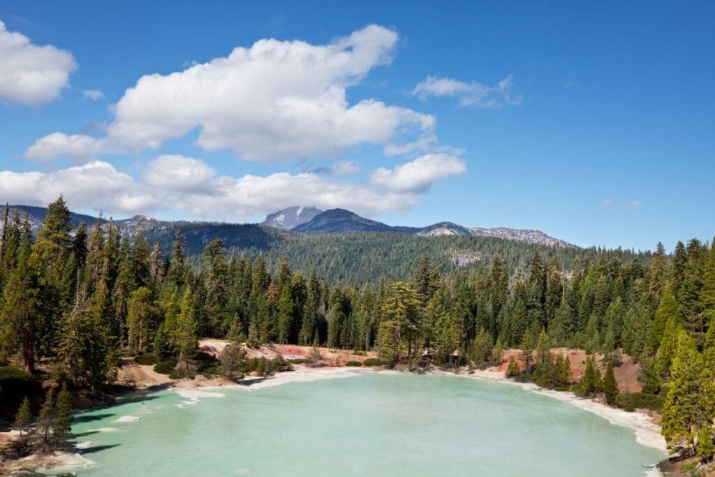 blue sky over a turquoise lake in lassen volcanic national park