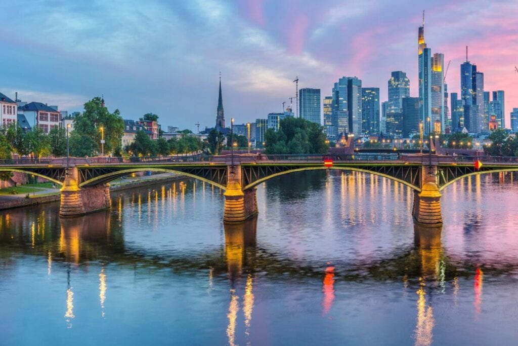 sunset over the waterfront and bridge in frankfurt germany
