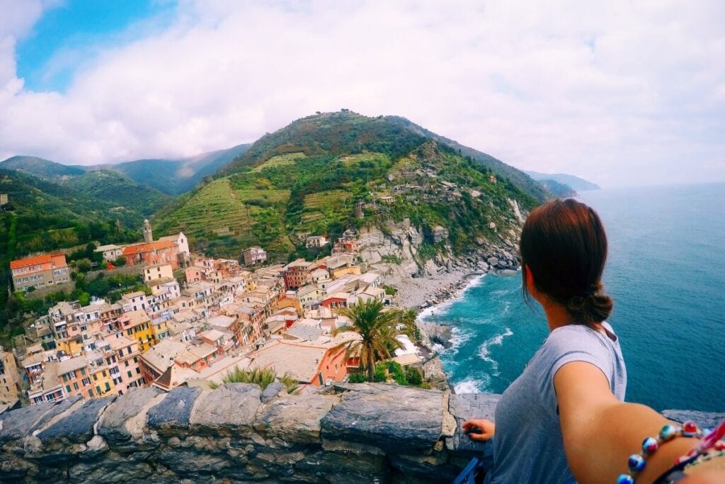 girl looking at the coast from the tower in vernazza cinque terre italy