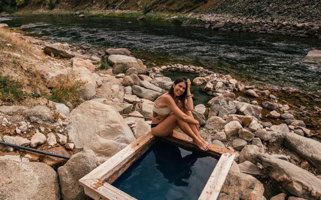 girl soaking in sunbeam hot springs idaho