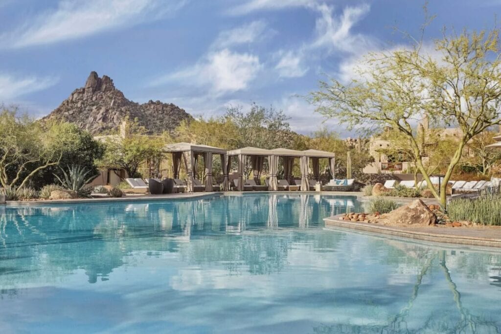 sunny day over the four seasons resort and spa scottsdale pool area
