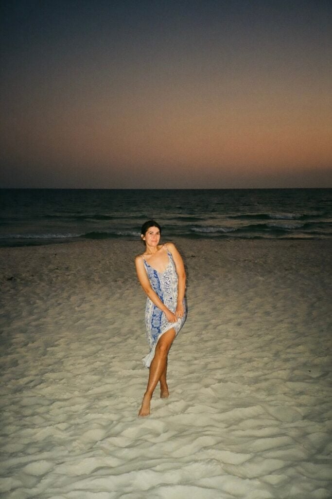 girl standing at rosemary beach fl after sunset