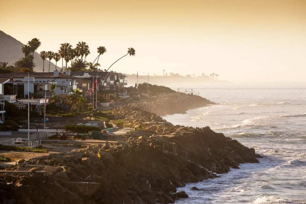 golden hour over malibu california with the ocean waves crashing