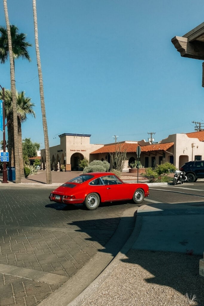 red porsche driving down old town scottsdale arizona