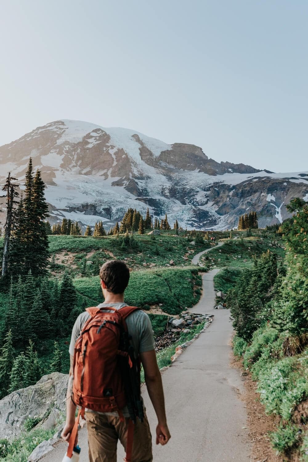 male hiker walking along skyline trail mt rainier