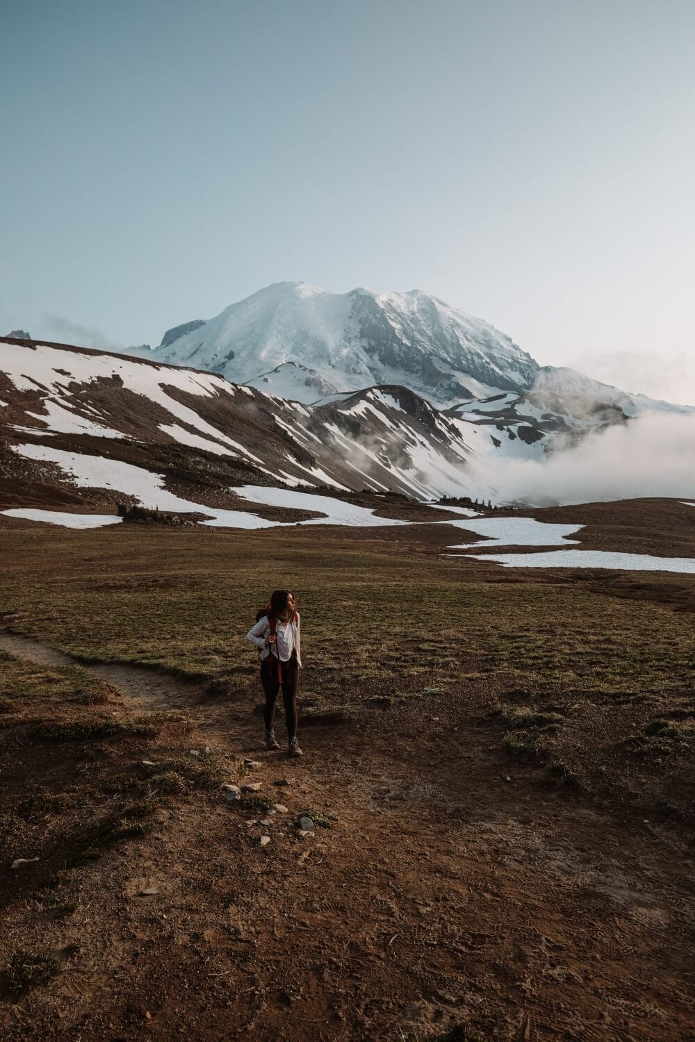 female hiker walking sourdough ridge trail mount rainier