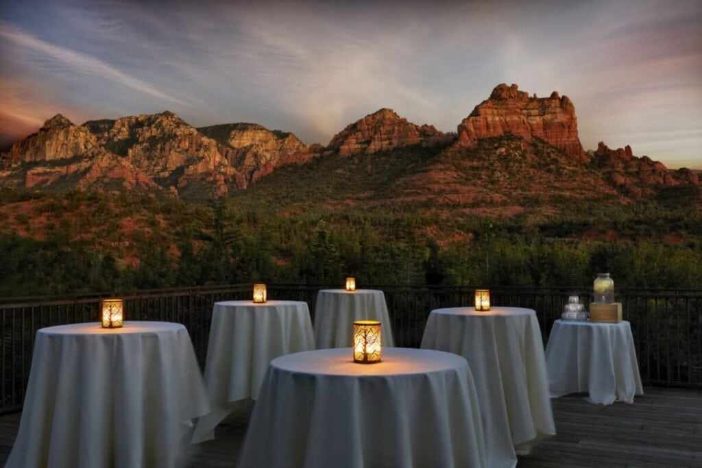 dining tables with candles by L’Auberge de Sedona