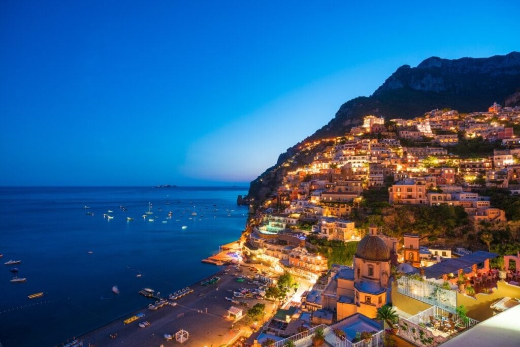 bright lights shining from the amalfi coast